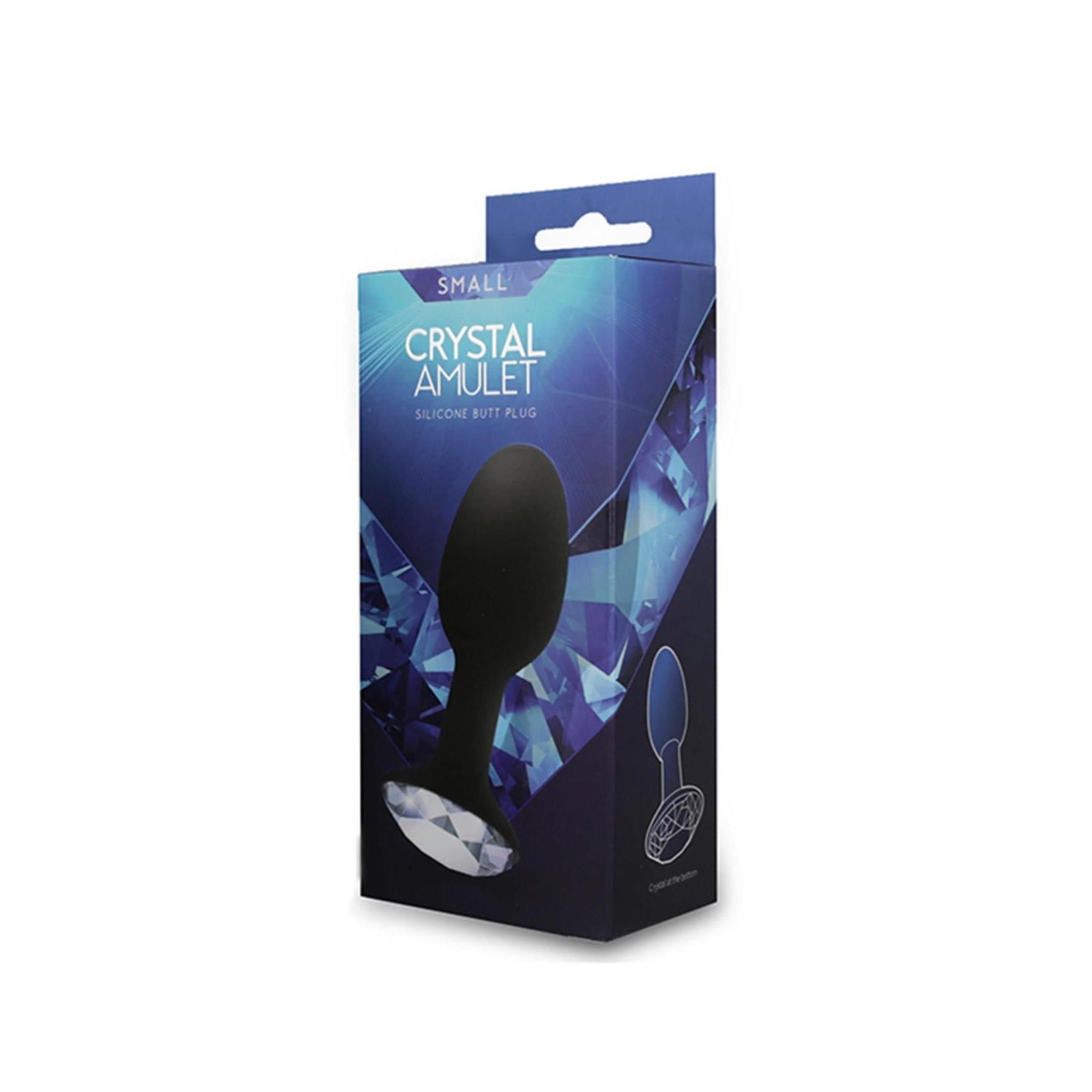 Schwarzer Silikon-Butt Plug in Verpackung. Aufschrift: CRYSTAL AMULET SILICONE BUTT PLUG. Kleiner Größe.