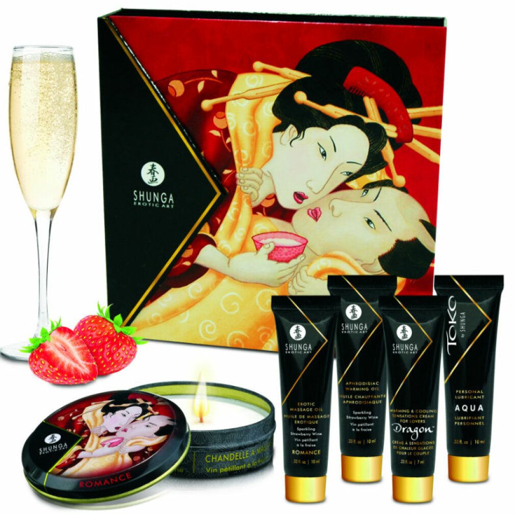 Geschenkset mit Sekt, Erdbeeren, Cremes, Kerze und Karton. Schwarze Tuben mit goldenen Akzenten. Dose mit Geisha-Motiv.