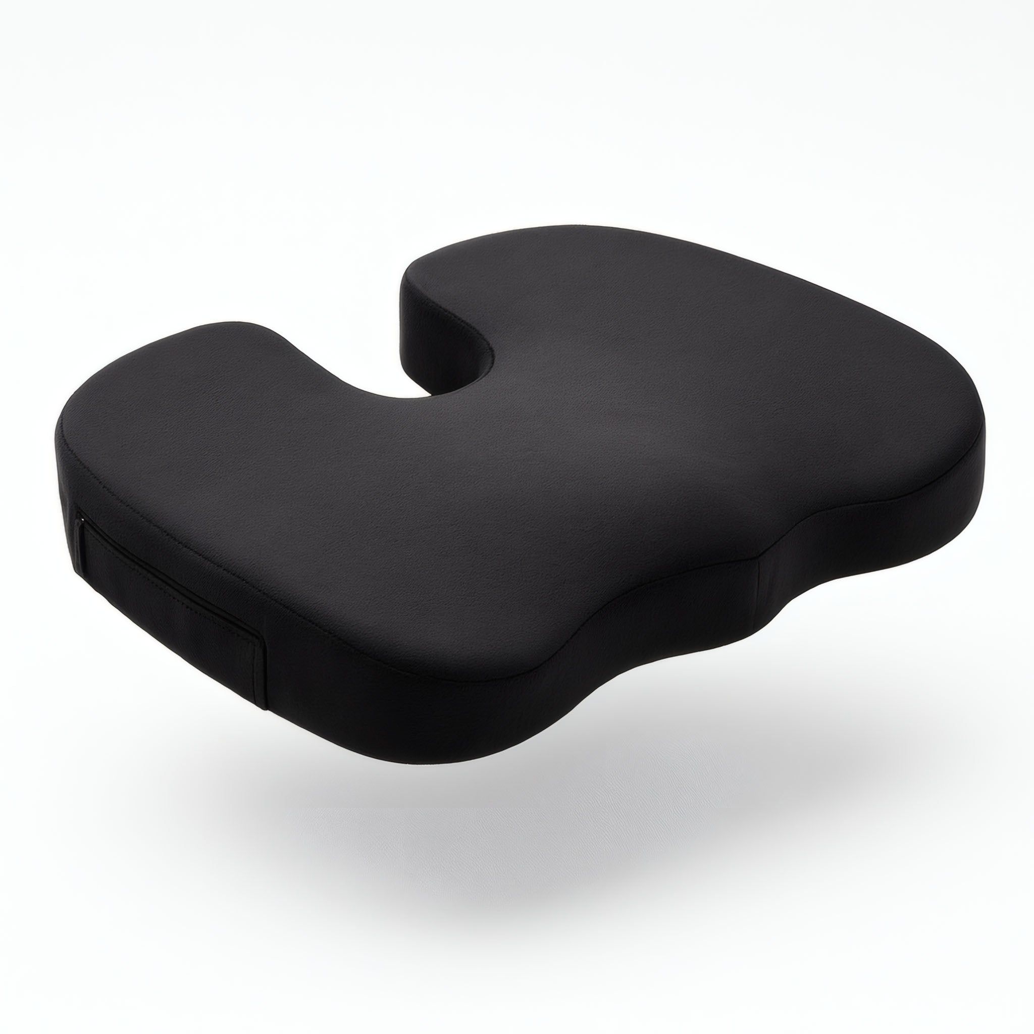 Schwarzes, ergonomisches Sitzkissen mit Aussparung für druckentlastendes Sitzen.