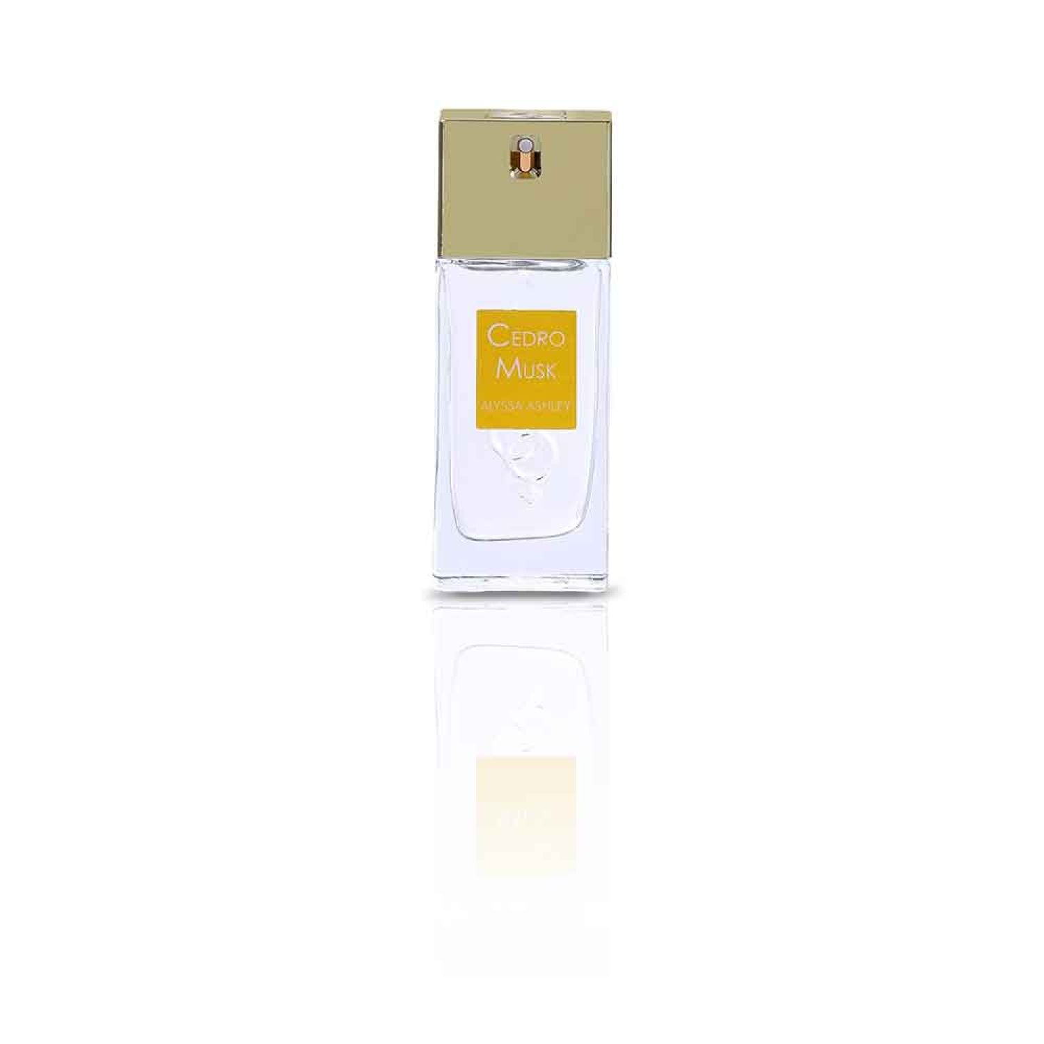 Parfümflakon mit goldfarbenem Deckel und gelbem Etikett mit "Cedro Musk" und "Alyssa Ashley".