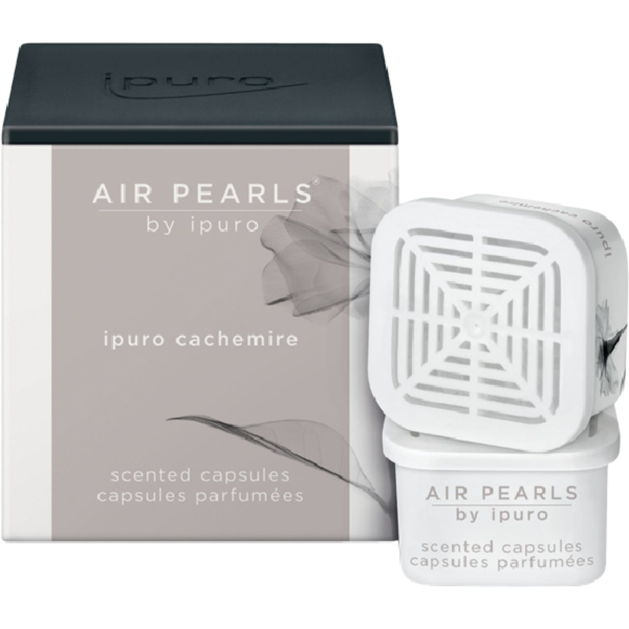 Verpackung und Kapseln. Auf der Verpackung: "AIR PEARLS by ipuro", "ipuro cachemire", "scented capsules". Weiße Kapseln.