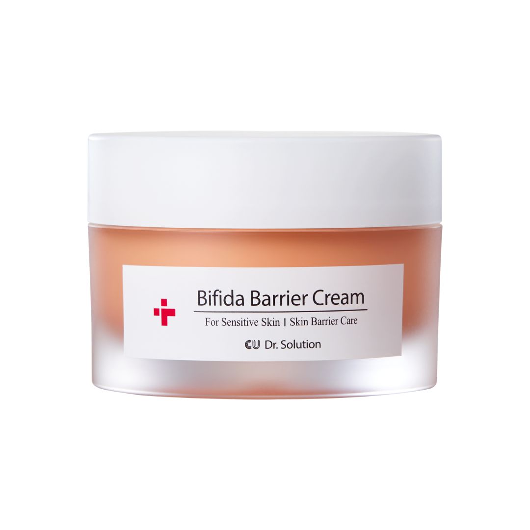 Creme-Glas mit weißem Deckel. Aufkleber mit Text: Bifida Barrier Cream, CU Dr. Solution. Rosa Creme sichtbar.