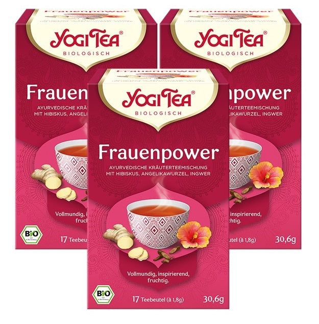 Drei Packungen Tee. Aufdruck: Yogi Tea, Frauenpower, ayurvedische Kräutermischung mit Hibiskus, Angeliwurz, Ingwer. Bio-Siegel.