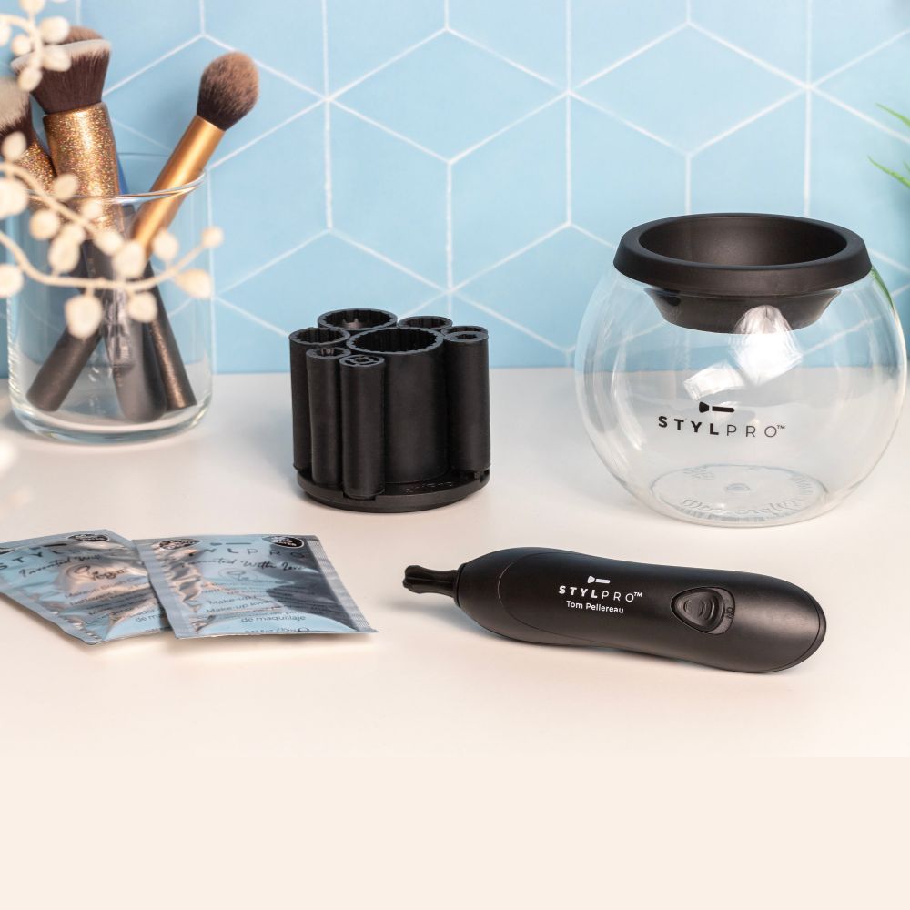 STYLPRO Pinselreiniger-Set mit Gerät, Halterung, Beuteln und Glasbehälter.