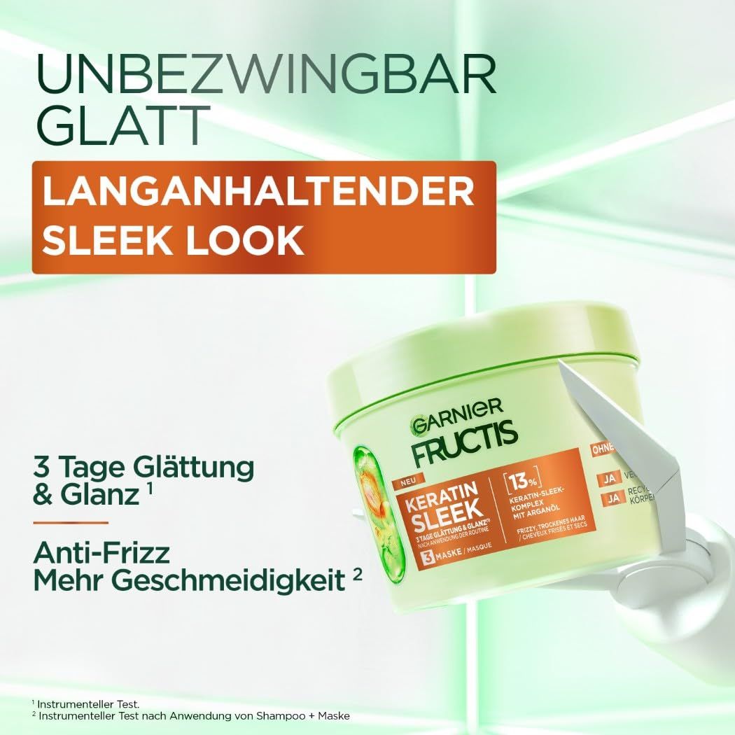 Garnier Fructis Keratin Sleek Maske. Grüne Dose mit Produktnamen und Angaben zu Geschmeidigkeit und Glanz.