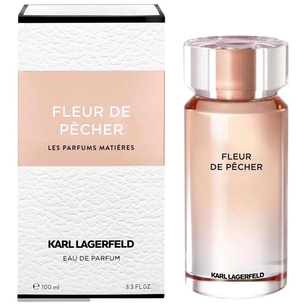 Parfümflakon mit weißer Verpackung. Aufschrift: Fleur de Pêcher, Karl Lagerfeld. Flakon aus Glas mit rosafarbenem Inhalt.