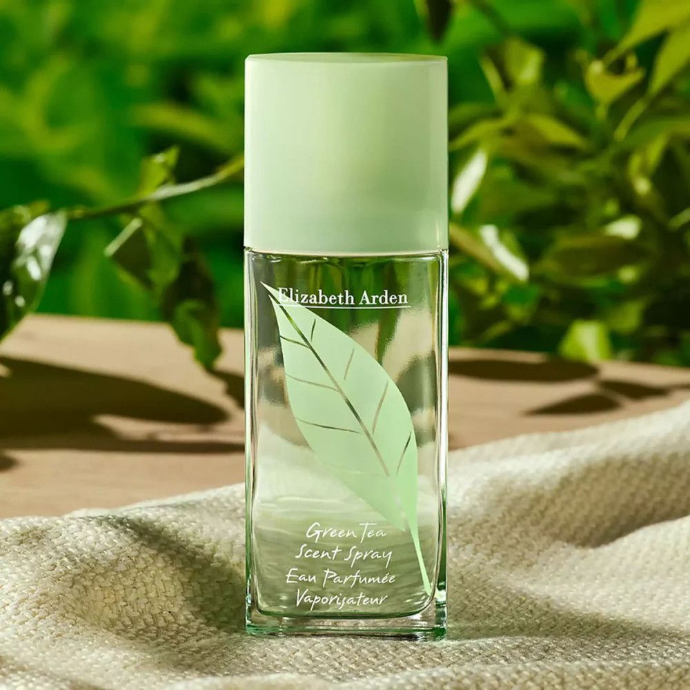 Grüner Tee Eau Parfumée Spray-Flakon. Rechteckige Form, grüner Deckel, Blatt-Dekor. Elizabeth Arden-Logo.