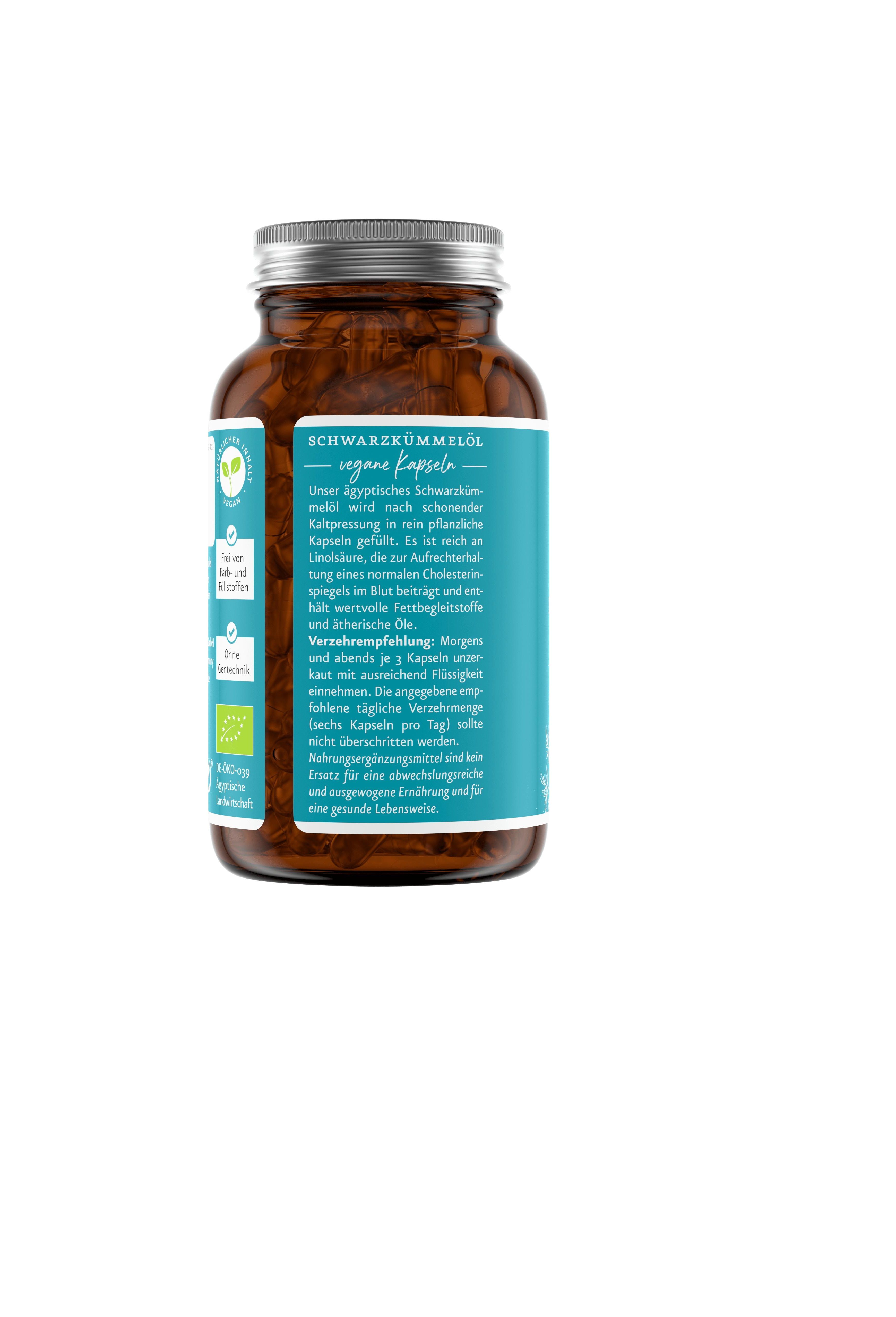Rückseite einer braunen Glasflasche mit Etikett. Text in deutscher Sprache. Vegan-Siegel.