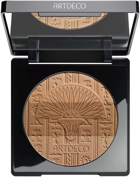 Bronzing Powder in schwarzer quadratischer Kompaktverpackung mit Spiegel. Geätztes Design mit Sonnenmotiv und Hieroglyphen. ARTDECO-Logo.