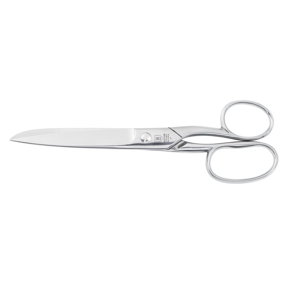 Silberne Schere mit abgerundeten Griffen. Logo und Schriftzug auf der Klinge.