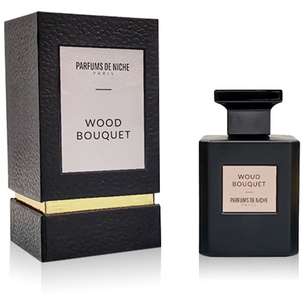 Schwarze Parfümflasche und ihre Verpackungsbox. Beide tragen das Etikett "WOUD BOUQUET PARFUMS DE NICHE PARIS".