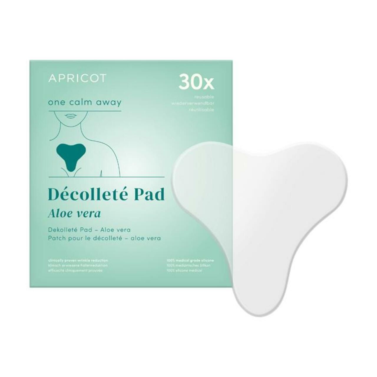 Weißes, herzförmiges Dekolleté Pad neben einer Verpackung. Verpackung mit Produktname, Marke APRICOT und 30 Stück.