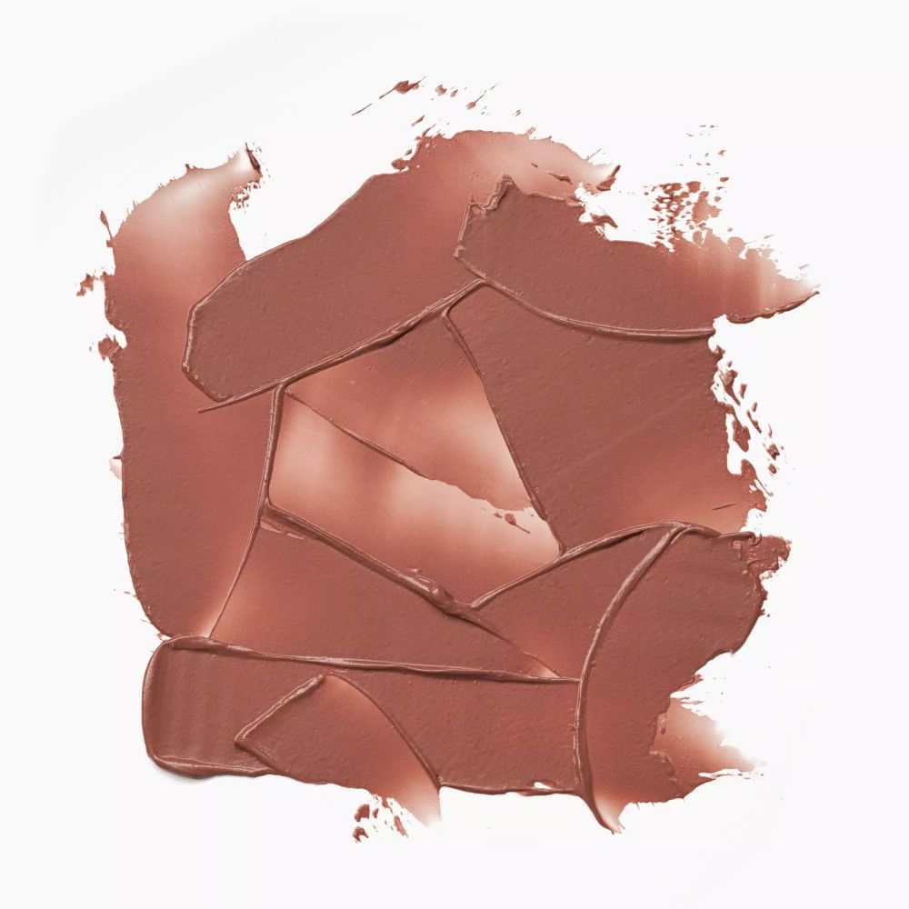 Heller Lippenbalsam-Abstrich auf weißem Hintergrund. Verschiedene Formen und Größen.