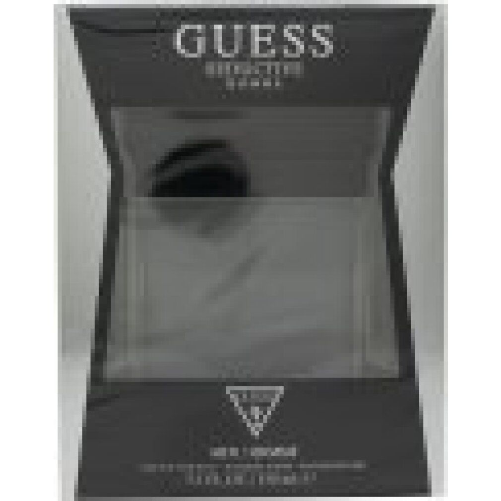 Verpackung mit transparentem Fenster. Auf der Verpackung steht 'GUESS Seductive Homme'. Logo. Text: 'MEN/HOMME'.