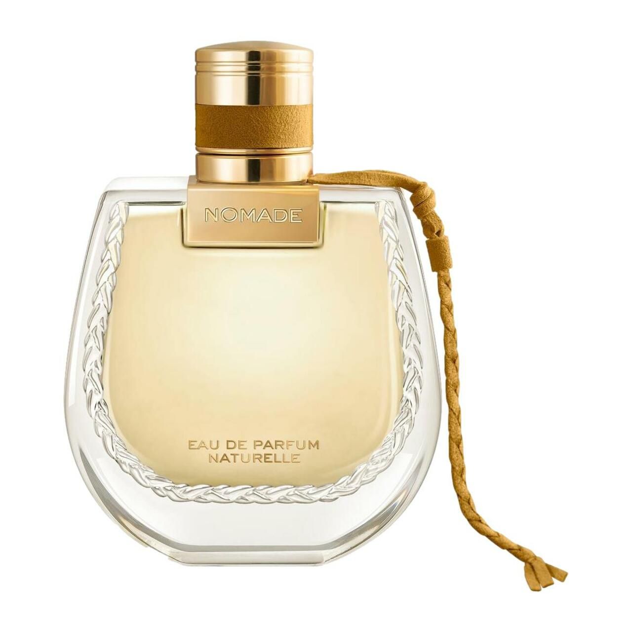 Parfümflasche. Aufschrift: Nomade, Eau de Parfum Naturelle. Goldfarbener Verschluss und Kordel. Geätztes Glas.