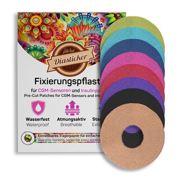 Packung mit Fixierpflastern. Mehrfarbige, runde Pflaster mit Loch in der Mitte. Aufschrift: Diasticker, Fixierungspflaster, wasserfest, atmungsaktiv.