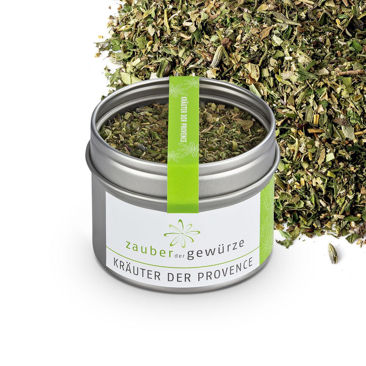Offener Metallbehälter mit Kräutern. Etikett mit Schriftzug: Zauber der Gewürze Kräuter der Provence. Grüner Streifen mit Schriftzug.