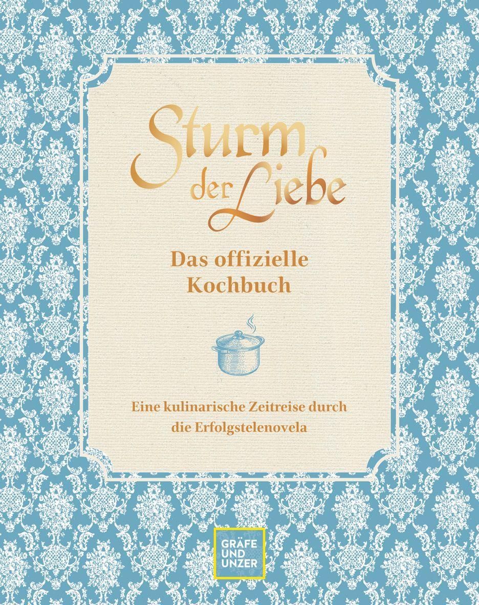 Kochbuch mit Titel "Sturm der Liebe". Hellblauer Hintergrund mit floralem Muster. Titel in goldener Schrift.