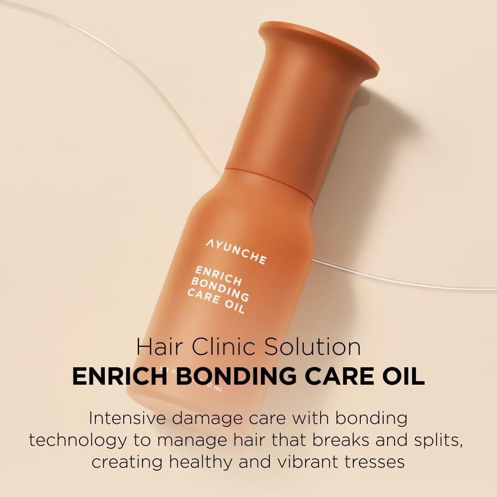 Orangefarbene Flasche mit Ayunche Enrich Bonding Care Oil Aufschrift. Haarklinik-Lösung.