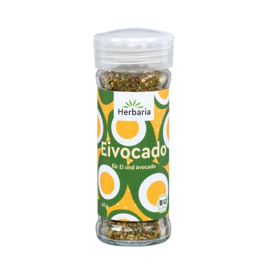 Glasflasche mit Gewürzmischung. Aufkleber mit "Herbaria Eivocado Bio", Eier- und Avocado-Motiv, Bio-Siegel.