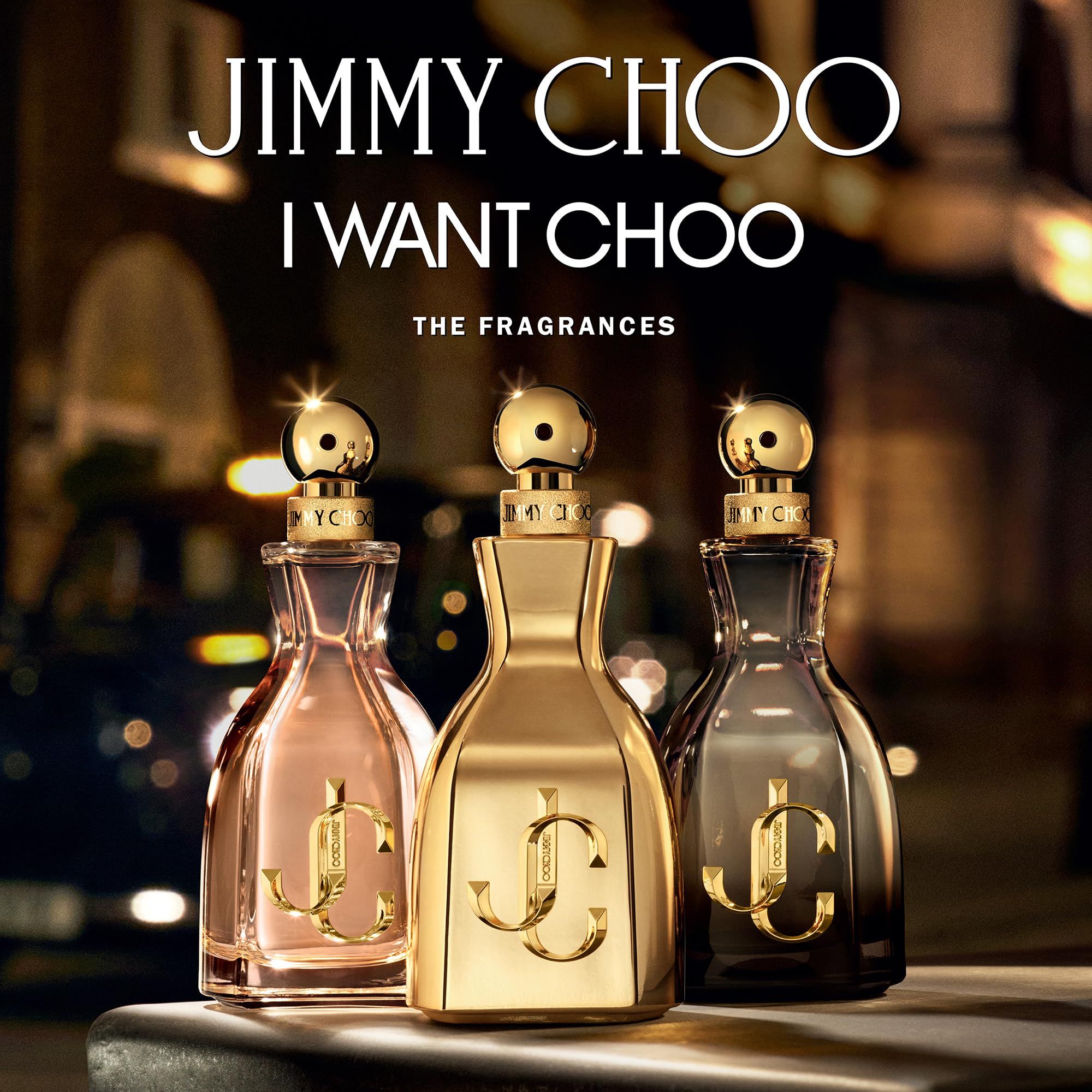 Drei Jimmy Choo i Want Choo Parfümflakons in verschiedenen Farben.