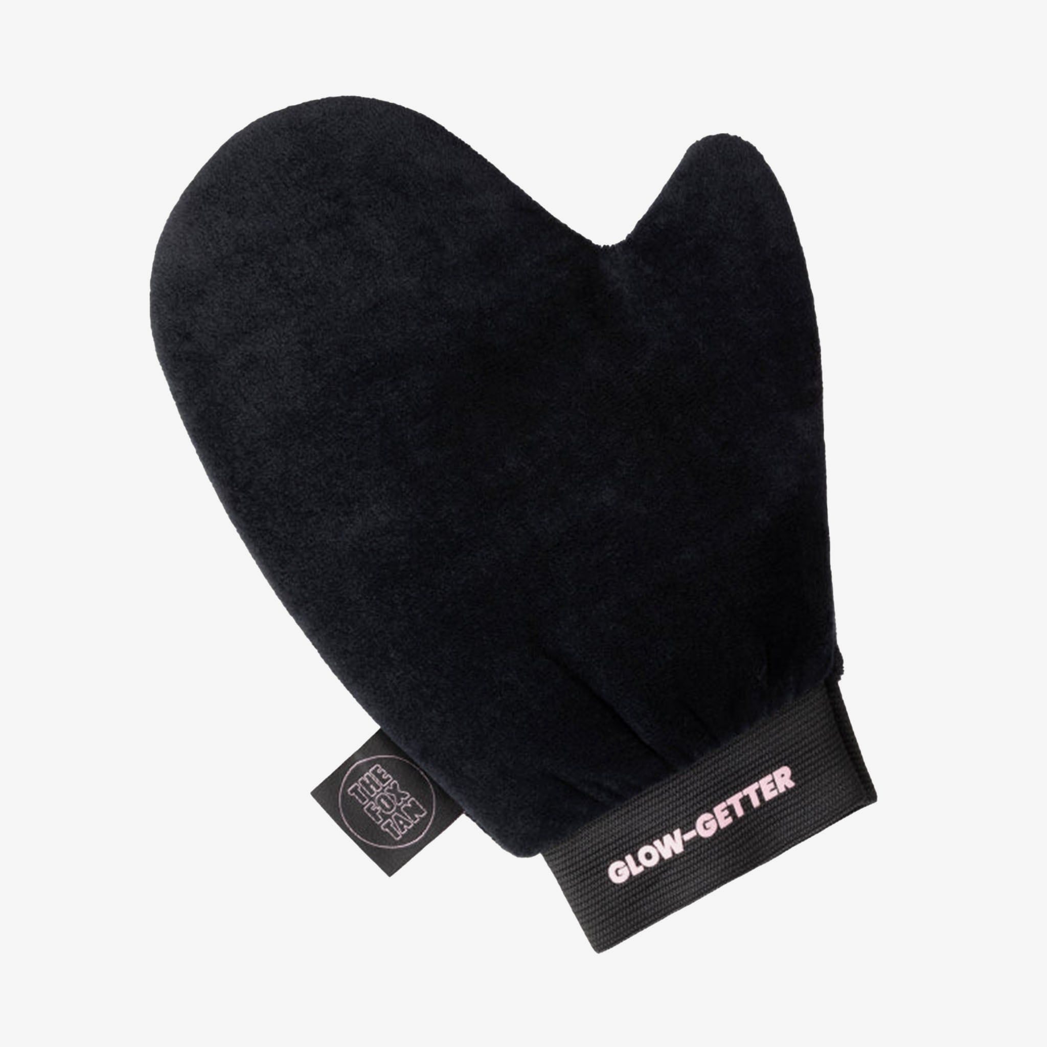 Gant noir en velours avec bande élastique au poignet. Le mot "GLOW-GETTER" est inscrit sur la bande. Une petite étiquette avec logo est attachée.