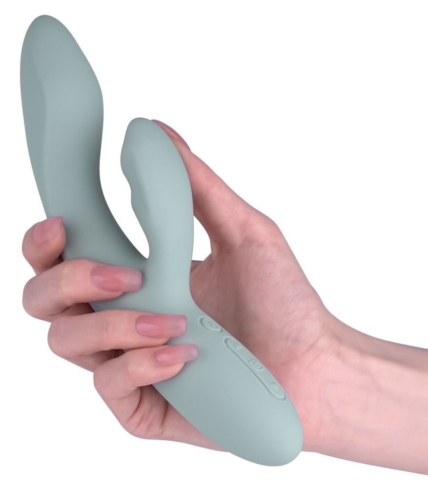 Hellblaues Vibrationsgerät in einer Hand gehalten. Sichtbare Bedienknöpfe.