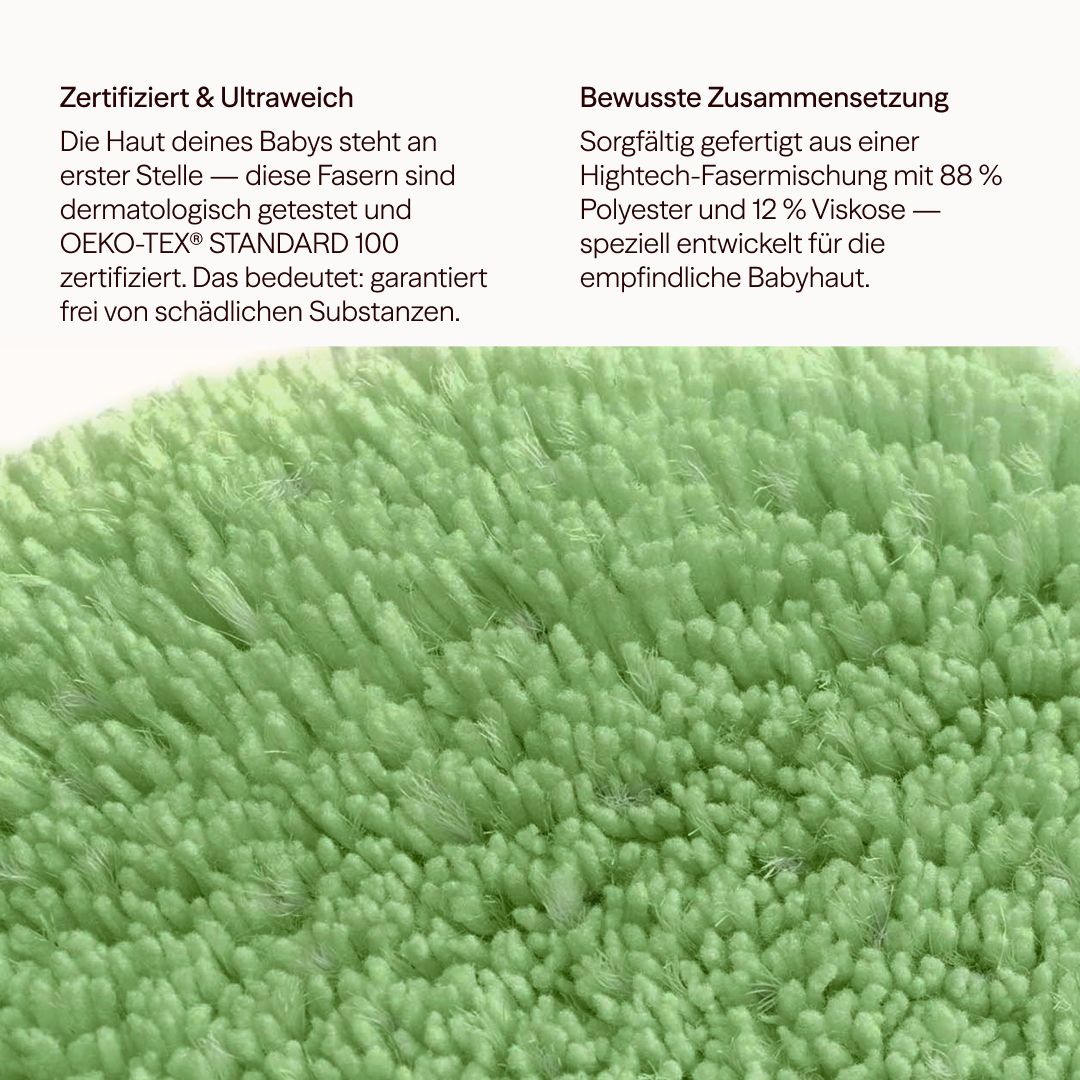 Nahaufnahme eines grünen Waschpads. Die Textur ist flauschig und dicht. Oeko-Tex-Zertifizierung.