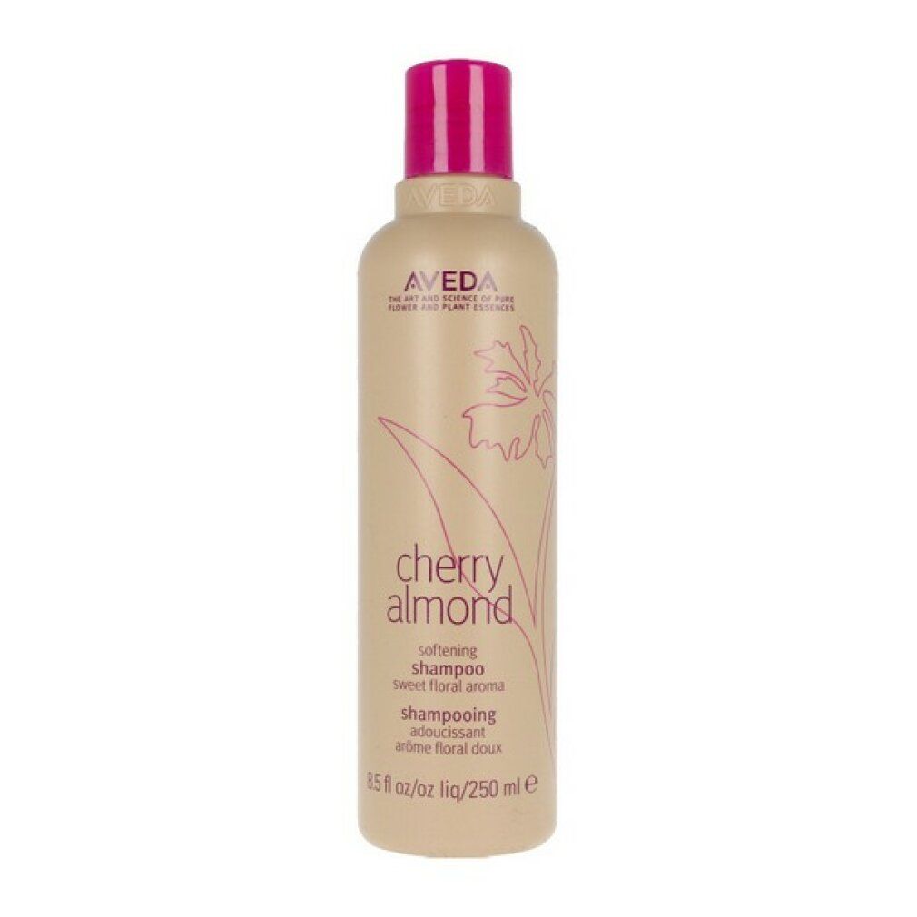 Kleine beige Shampoo-Flasche mit pinkfarbenem Deckel. Aufschrift: Aveda, Cherry Almond, Shampoo. 8.5 fl oz/250 ml.