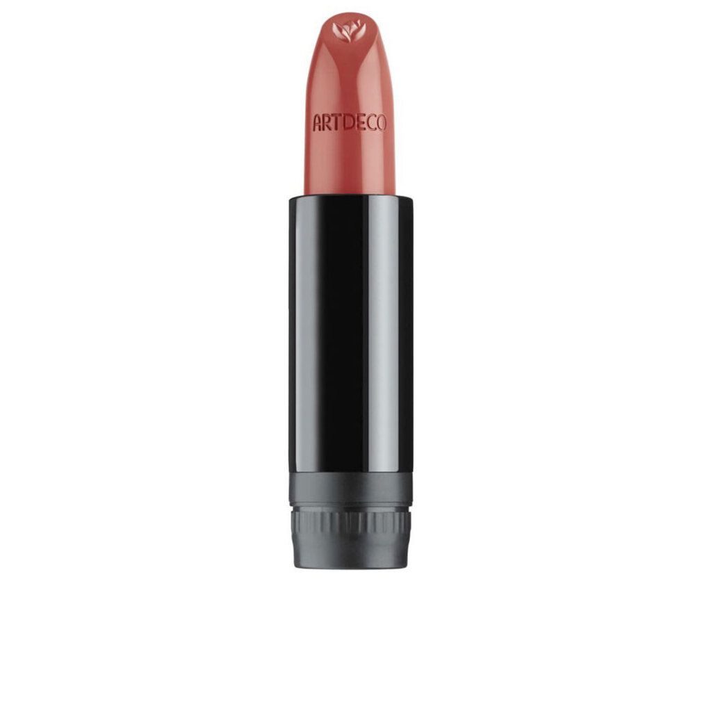 Lippenstift-Refill. Schwarze Hülse, rosafarbener Lippenstift mit Artdeco-Logo. Geöffnet.