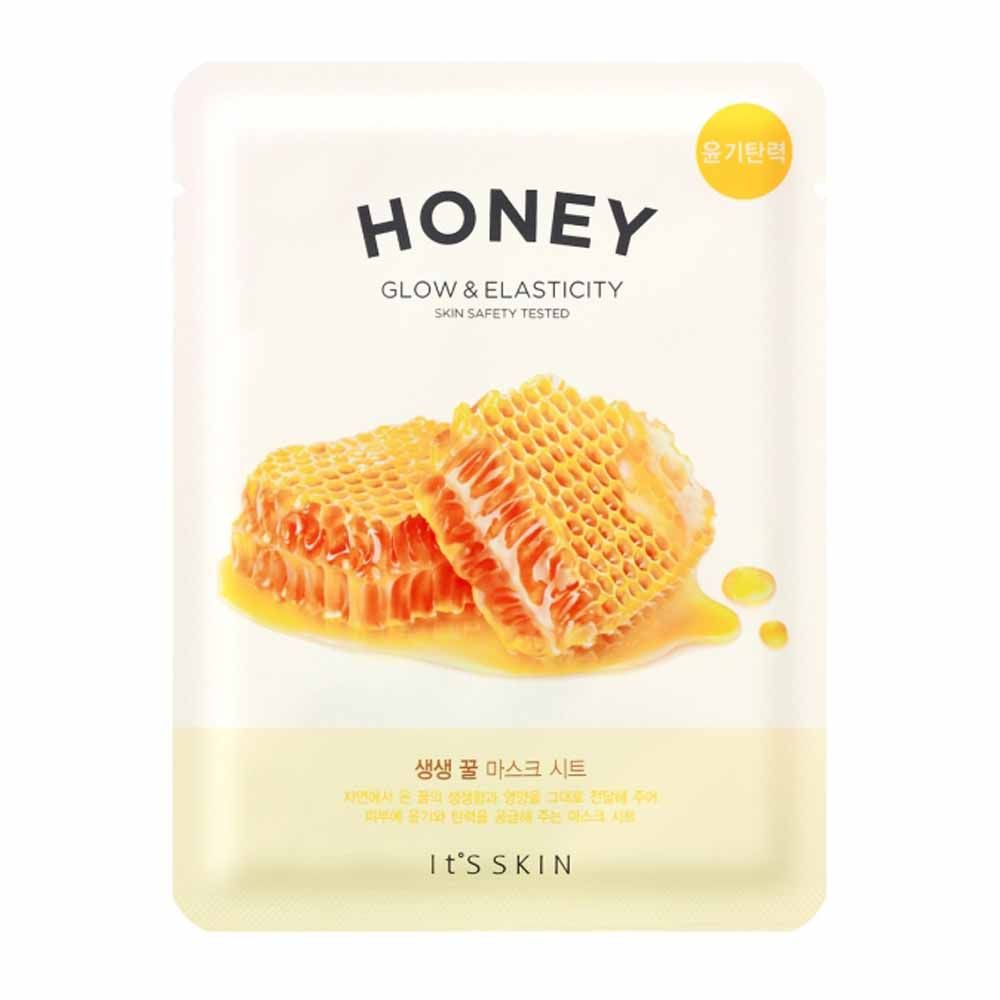 Gesichtsmaske mit Honig-Motiv. Text: HONEY, GLOW & ELASTICITY, SKIN SAFETY TESTED. Marke: IT'S SKIN.