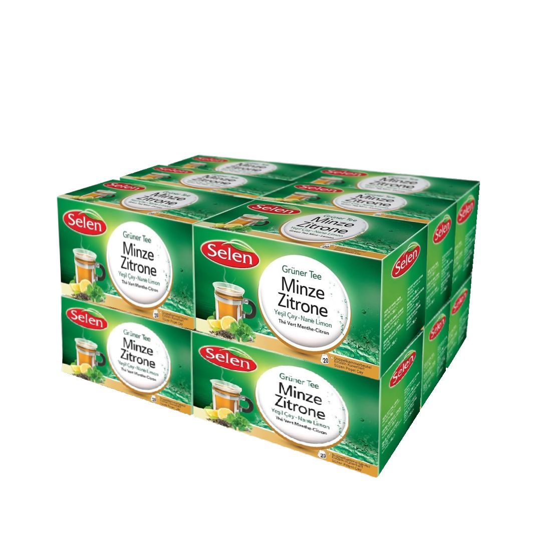 Mehrere grüne Kartons mit SELEN Grüner Tee Minze Zitrone. Aufdrucke: Teebecher, Zitrone, Minze. Verpackung mit rotem Logo.