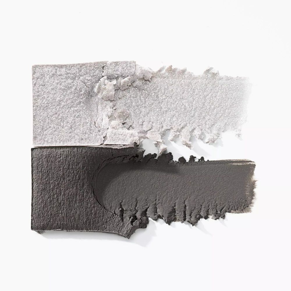 Abstriche von Catrice Diamond Treasures Lidschatten. Zwei Farben: Dunkelgrau und Silber. Textur sichtbar.