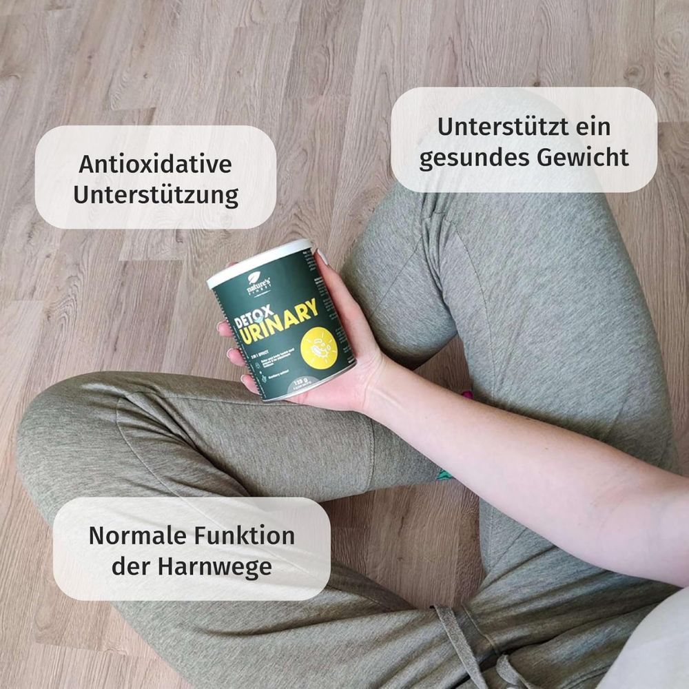 Person hält Dose Detox Urinary. Text: Antioxidative Unterstützung, gesunde Gewicht, normale Harnwege. Marke: Nature's Finest.