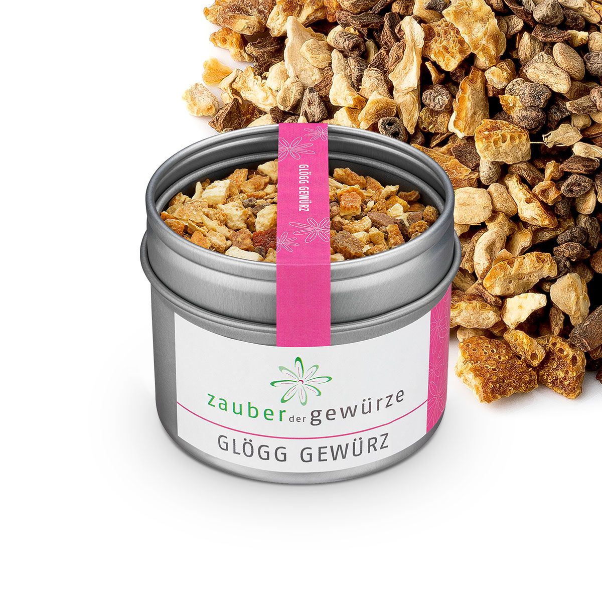 Geöffnete Dose Glögg Gewürz. Rosa Etikett mit Produktnamen. Gewürze liegen daneben.