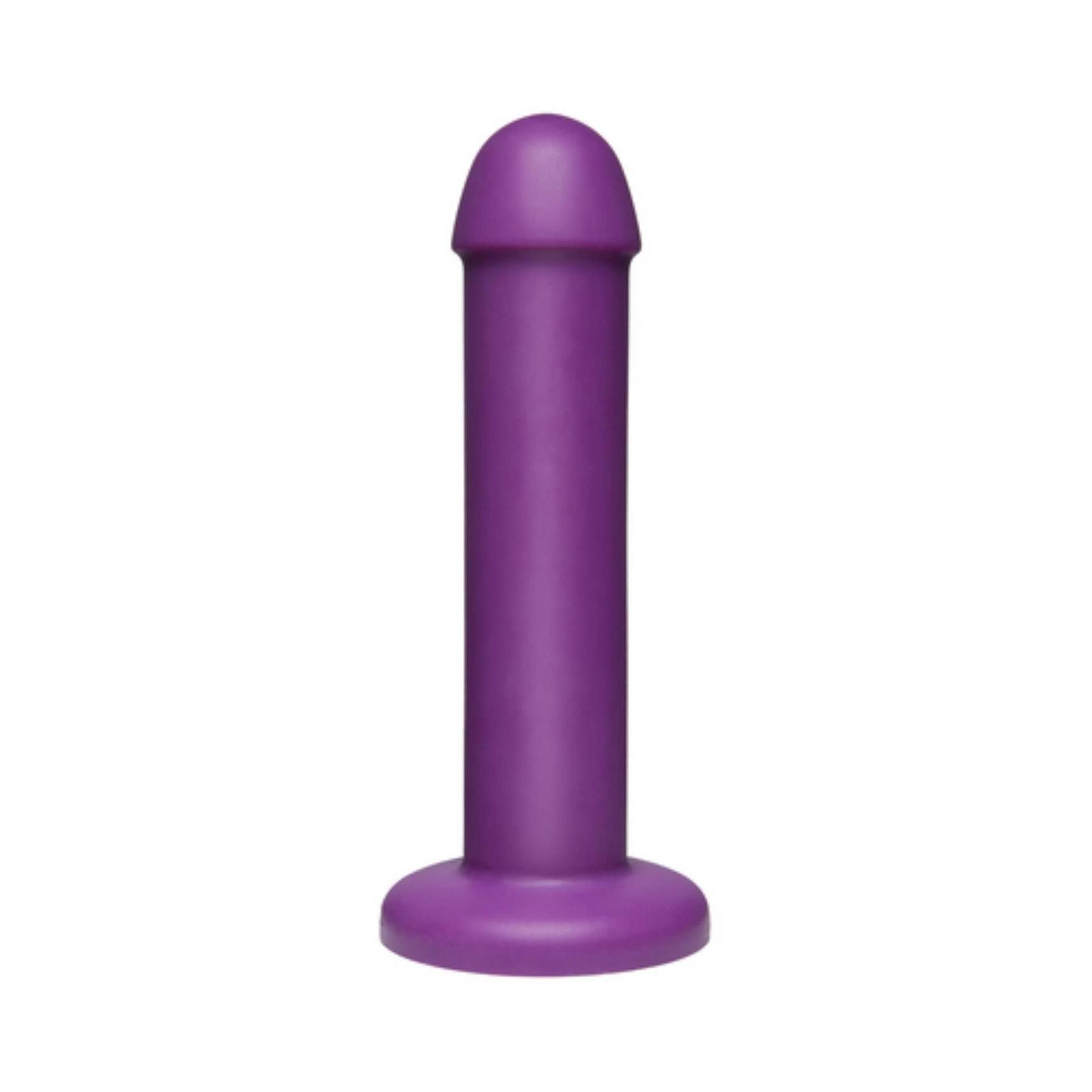 Lila Dildo. Zylindrische Form mit abgerundeter Spitze und Basis. Glatte Oberfläche.