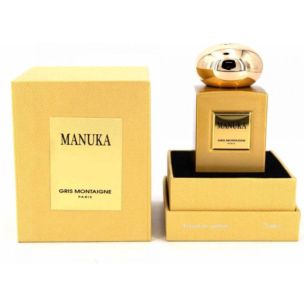 Flakon mit goldfarbenem Verschluss und Verpackung. Aufschrift MANUKA und GRIS MONTAIGNE PARIS.