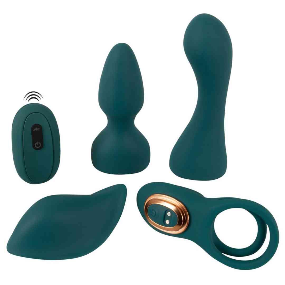 Set aus tealfarbenen Vibratoren und Fernbedienung. Enthält Ring, Aufsätze und Fernbedienung mit Symbolen.
