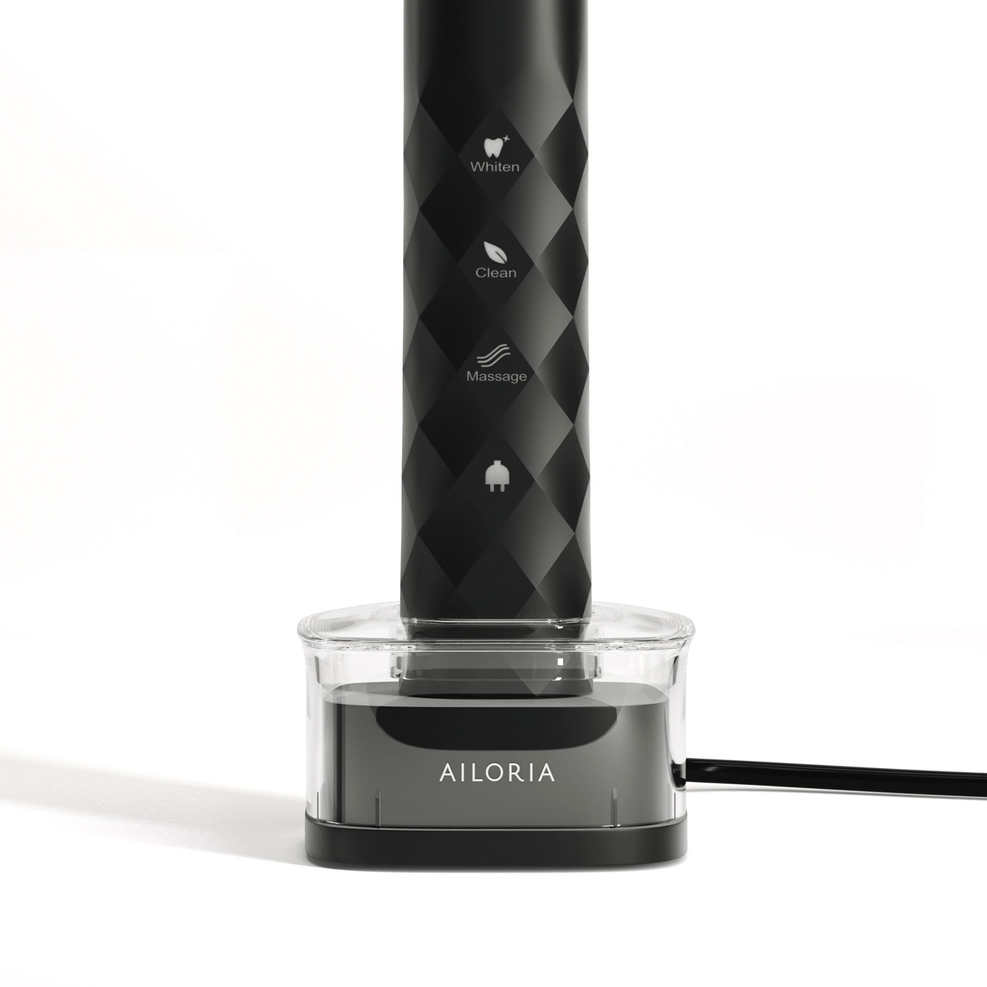 Zahnbürste in Ladestation. Schwarze Zahnbürste mit Funktionen. AILORIA-Schriftzug auf der Ladestation.
