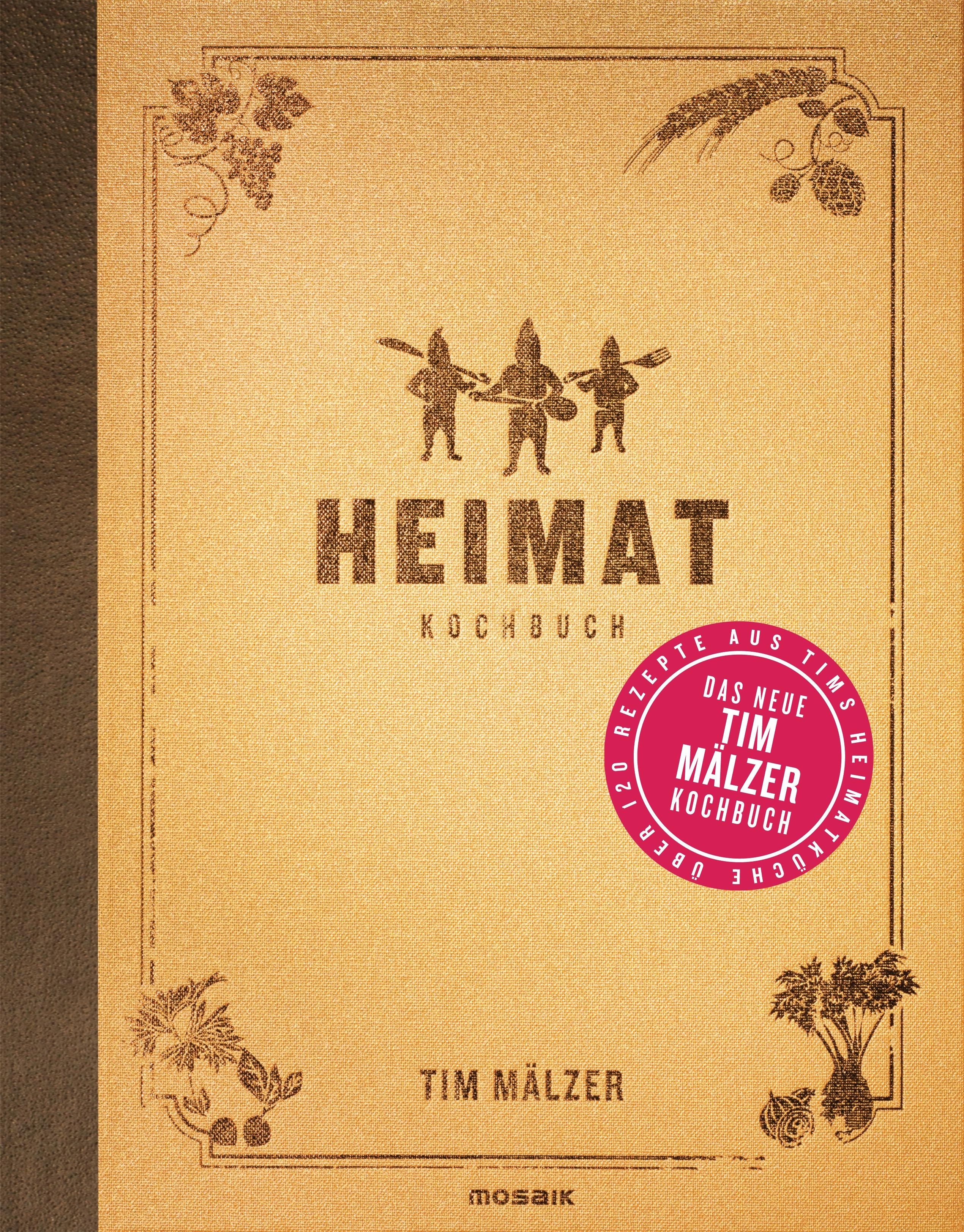 Kochbuch "Heimat" mit braunem Cover. Titel und Autor sichtbar. Aufkleber mit Text "Das neue Tim Mälzer Kochbuch".