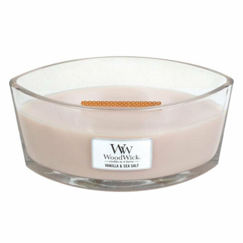 Ellipsenförmige Kerze in Glasbehälter. Etikett "Vanilla & Sea Salt". Holzdocht sichtbar.