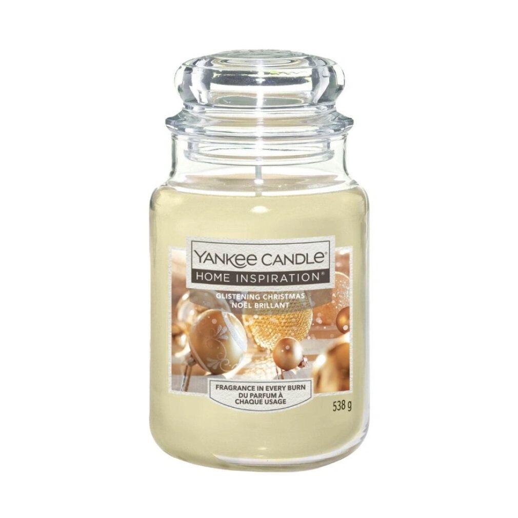 Große Duftkerze mit Glasdeckel. Aufkleber mit "Yankee Candle Home Inspiration". Text: "Glistening Christmas". Gewicht: 538 g.