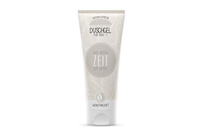 Duschgel-Tube mit floralem Muster. Text: "Duschgel für dich", "Die beste Zeit ist jetzt". Logo: Wohlfühlduft.