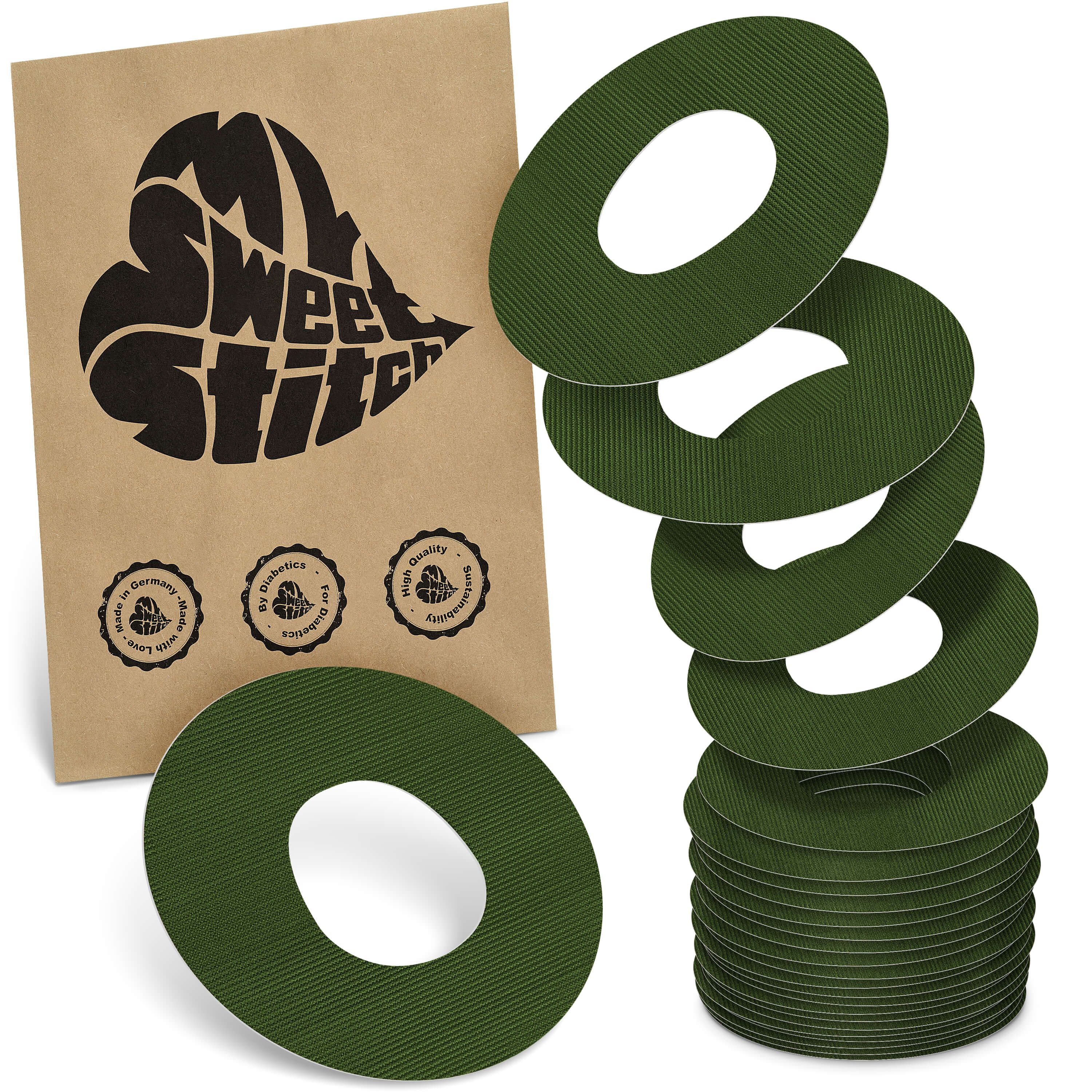 Grüne, runde Katheter Ringpatches mit zentraler Öffnung. Verpackung mit Logo 'MySweetStitch'. Mehrere Patches gestapelt.