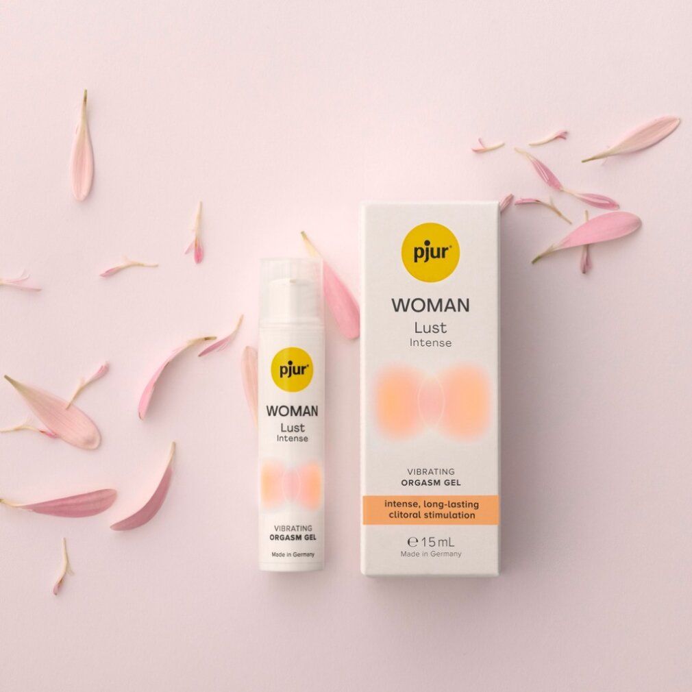 Produktverpackung und Flasche mit Blütenblättern. Text: WOMAN Lust Intense, Vibrating Orgasm Gel, intense, long-lasting clitoral stimulation, e 15ml, Made in Germany.