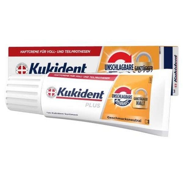 Kukident Plus Haftcreme Tube und Verpackung mit Aufdruck 'Unschlagbare ganztägiger Halt'.