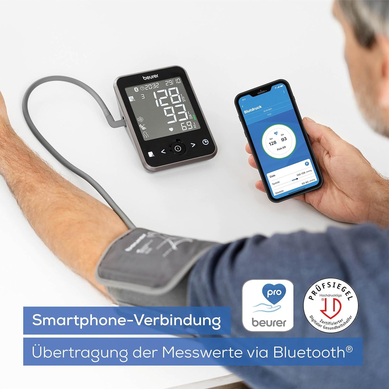Blutdruckmessgerät und Smartphone. Messwerte werden via Bluetooth übertragen. Marke: Beurer. Siegel: Geprüfte Qualität.