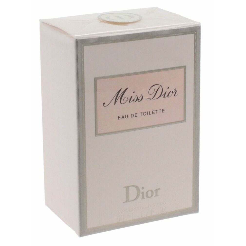 Rosafarbener Karton mit Aufschrift Miss Dior Eau de Toilette. Dior-Logo unten. Weißer Hintergrund.