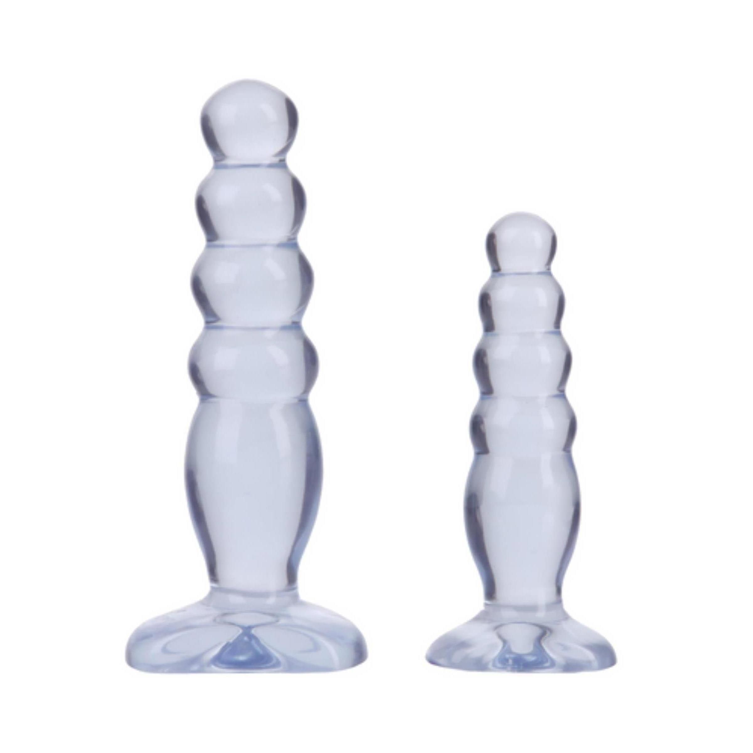 Zwei transparente Anal-Trainer. Geriffelt, mit Basis. Unterschiedliche Größen.
