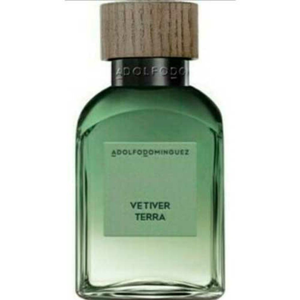 Grüne Glasflasche mit Holzdeckel. Aufschrift: ADOLFODOMINGUEZ, VETIVER TERRA. Eau de Parfum Spray.